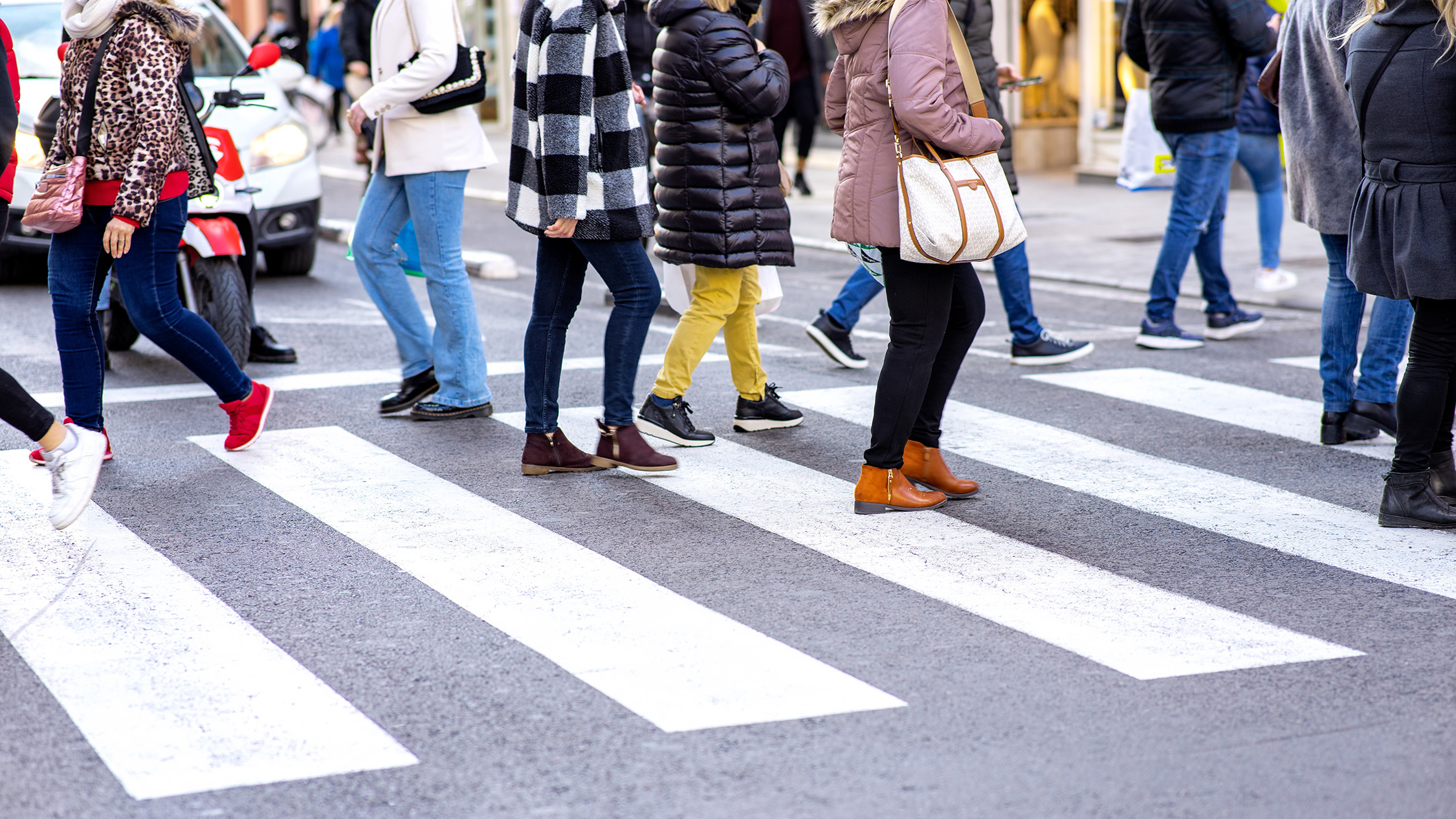 Crosswalk with many pedestrians crossing. Image Credit: AdobeStock_482691976